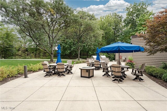 27500 Cedar Rd Unit T-8, Beachwood, OH 44122 - view of patio featuring outdoor dining space and view of scattered trees