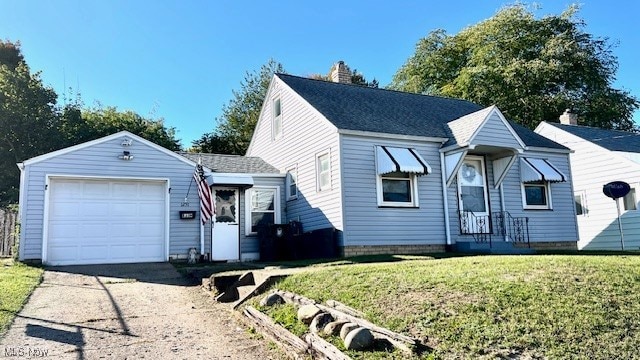 view of front of property featuring a garage and a front lawn