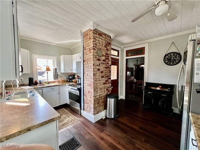 kitchen with crown molding, dark hardwood / wood-style flooring, sink, stainless steel appliances, and white cabinetry