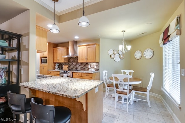 kitchen featuring wall chimney exhaust hood, tasteful backsplash, stainless steel appliances, hanging light fixtures, and ornamental molding