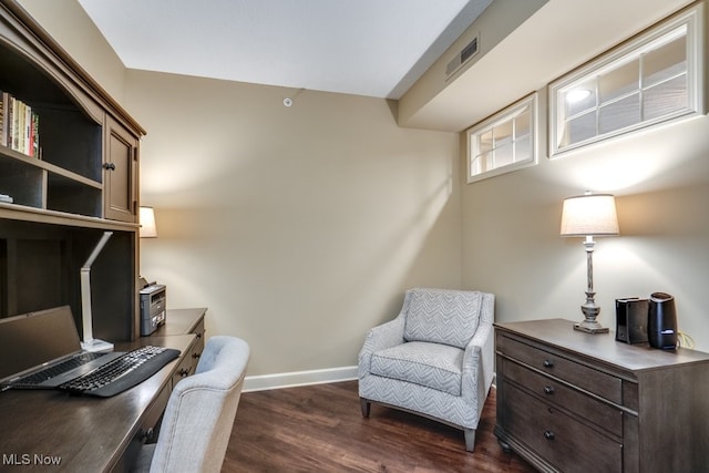 home office with dark hardwood / wood-style flooring