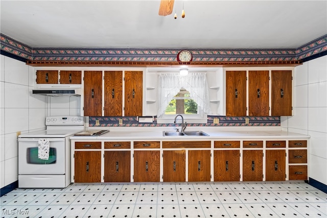 kitchen featuring white range with electric cooktop, backsplash, and sink