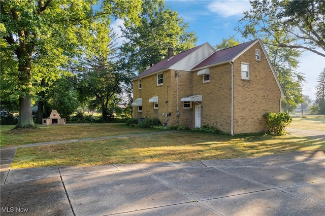 view of home's exterior featuring a yard