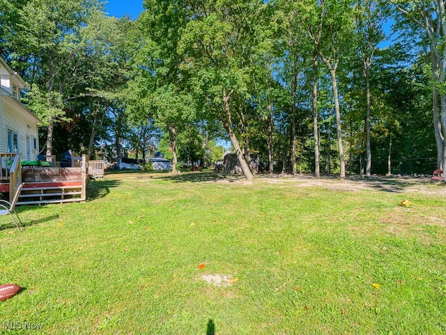 view of yard featuring a deck