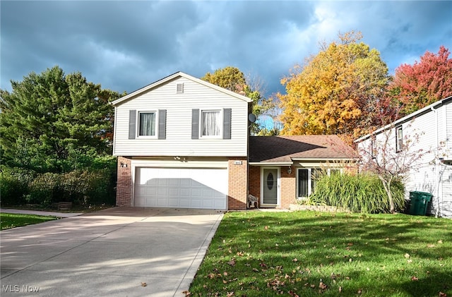 view of front of property with a front lawn and a garage