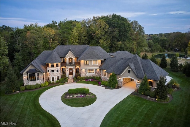 french country inspired facade featuring a front yard