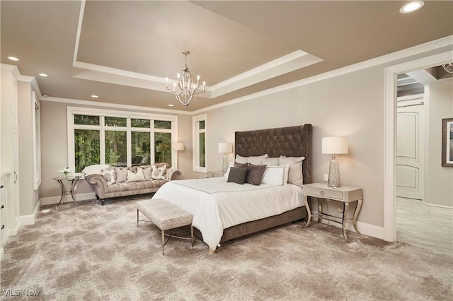 bedroom featuring a raised ceiling, crown molding, carpet floors, and a chandelier