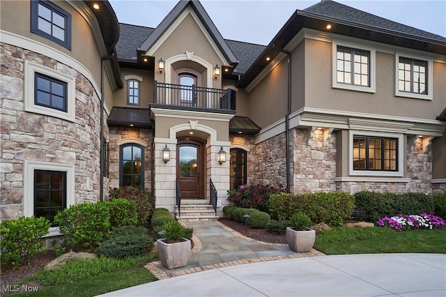 view of front of home with a balcony