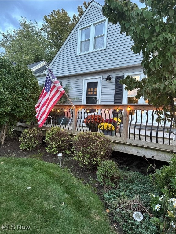 back of house featuring a deck