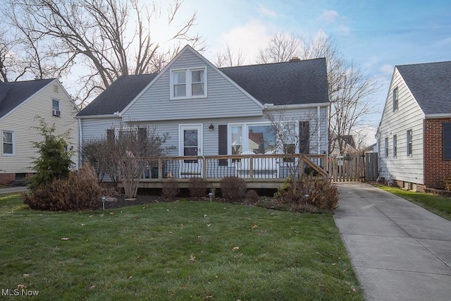 view of front of house with a yard and a wooden deck