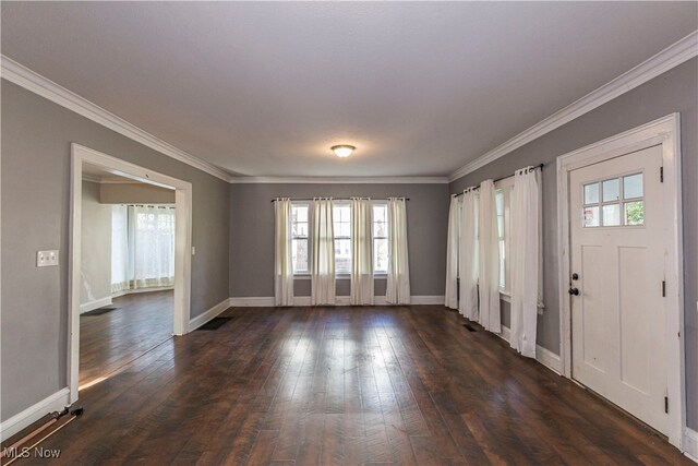 unfurnished room featuring plenty of natural light, ornamental molding, and dark hardwood / wood-style flooring