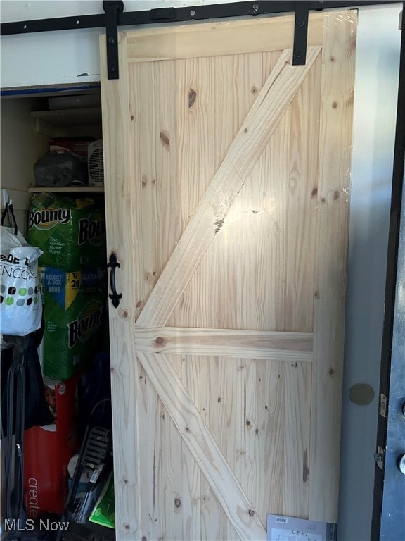 room details featuring a barn door