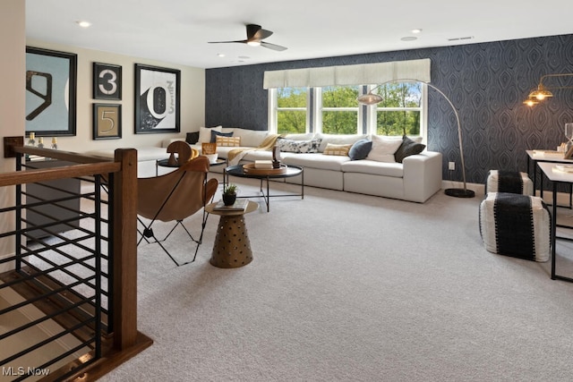 living room with ceiling fan and carpet flooring