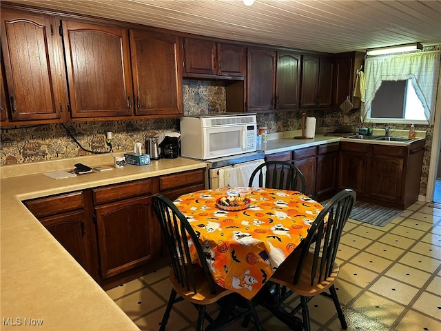 kitchen featuring decorative backsplash, wooden ceiling, sink, and light tile patterned floors