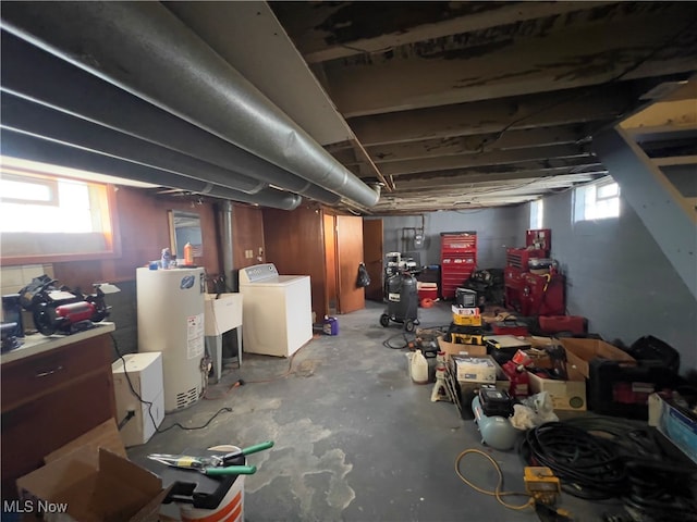 basement with gas water heater and washer / dryer