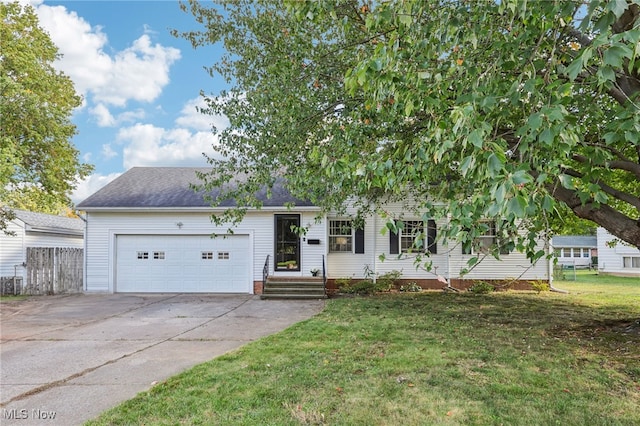 view of front of house with a garage and a front lawn