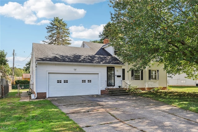 view of front facade with a front yard and a garage