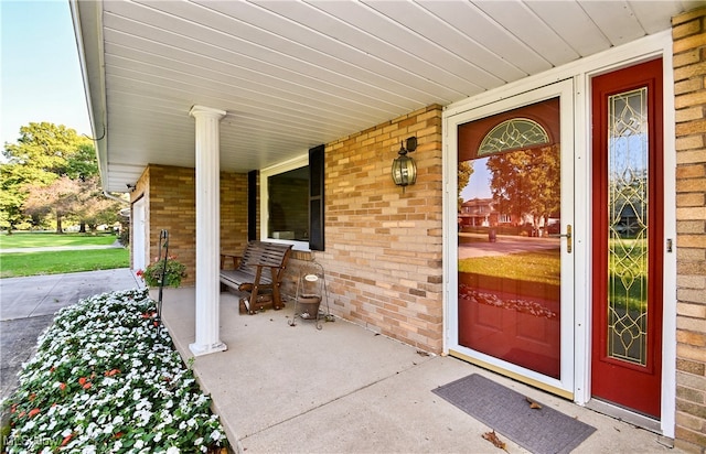 entrance to property featuring covered porch