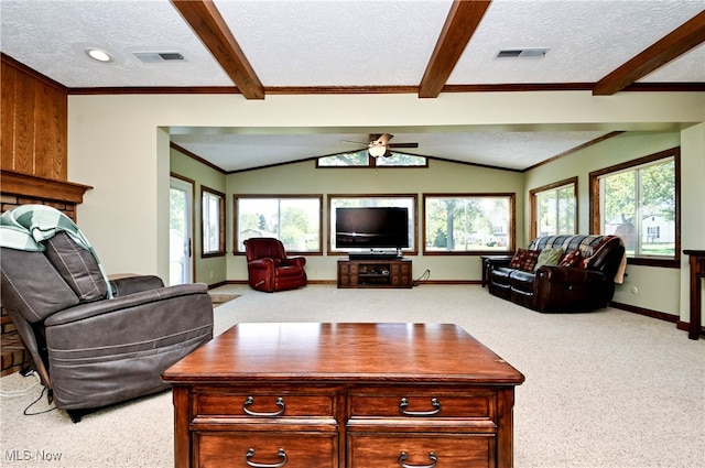 carpeted living room featuring a wealth of natural light and a textured ceiling