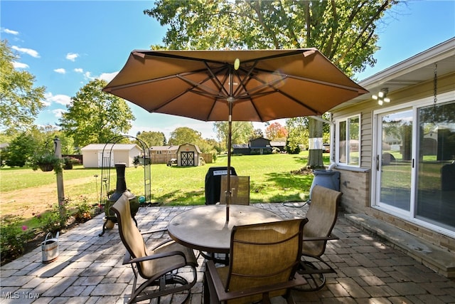 view of patio / terrace featuring a shed