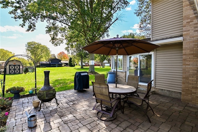 view of patio / terrace featuring a storage unit