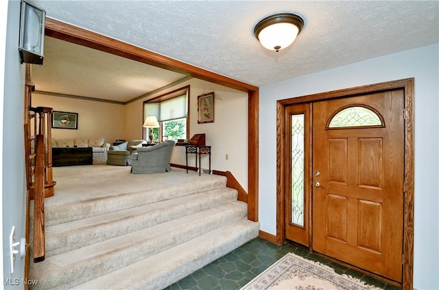 foyer featuring a textured ceiling