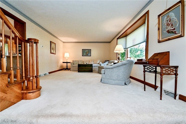 carpeted living room with ornamental molding