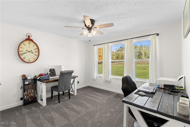 office with ceiling fan, dark carpet, and a textured ceiling