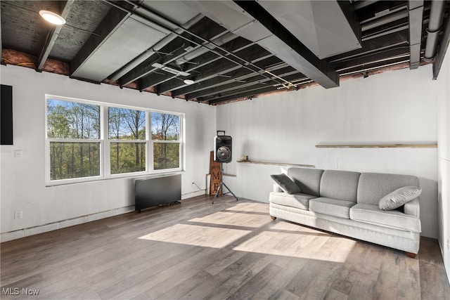 unfurnished living room with hardwood / wood-style flooring