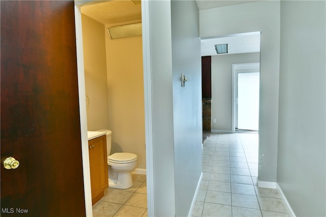 bathroom with tile patterned floors, vanity, and toilet