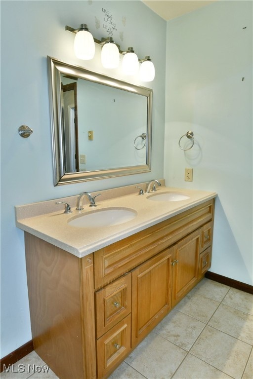 bathroom with vanity and tile patterned floors