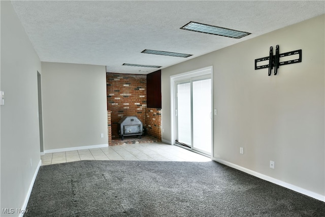 unfurnished living room with light carpet and a textured ceiling