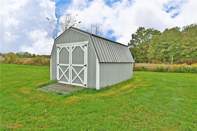 view of outdoor structure with a lawn