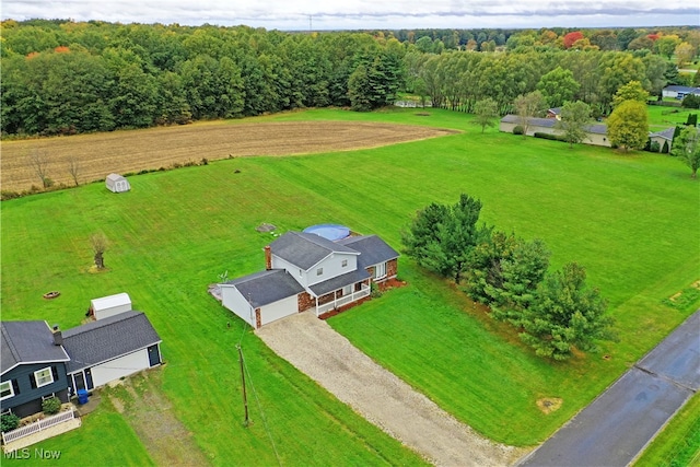 birds eye view of property with a rural view