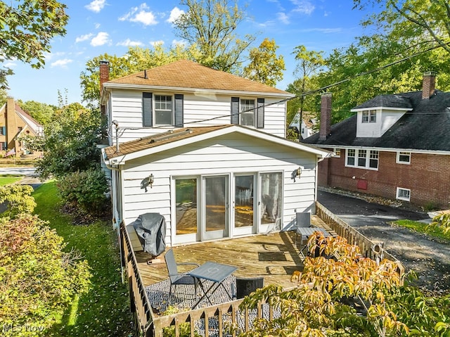 back of house featuring a deck