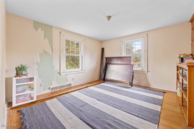 bedroom with light wood-type flooring