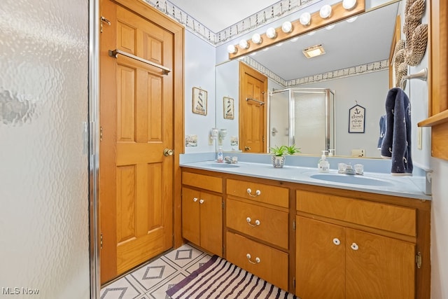 bathroom with vanity, tile patterned flooring, and walk in shower