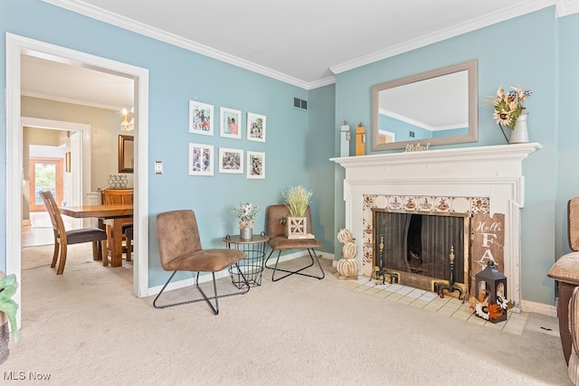 living area with light carpet, crown molding, and a tiled fireplace