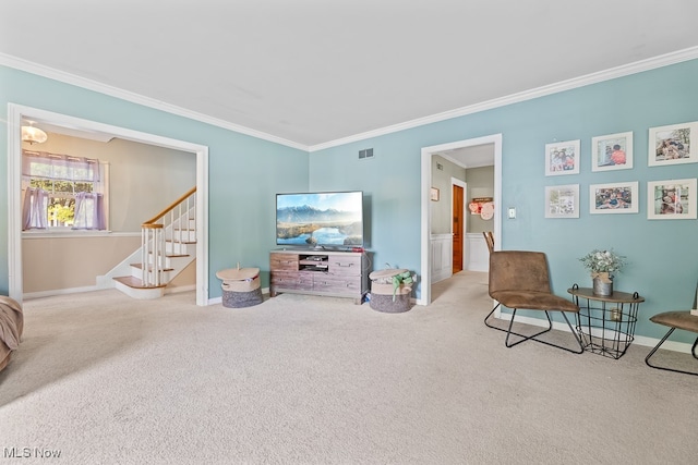 sitting room with carpet floors and ornamental molding