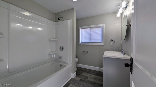 full bathroom featuring vanity, shower / bath combination, hardwood / wood-style floors, and toilet