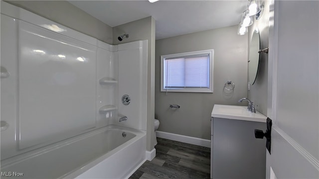 full bathroom featuring wood-type flooring, shower / tub combination, vanity, and toilet