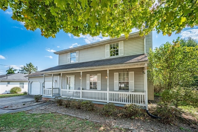 view of front of home with a garage and covered porch