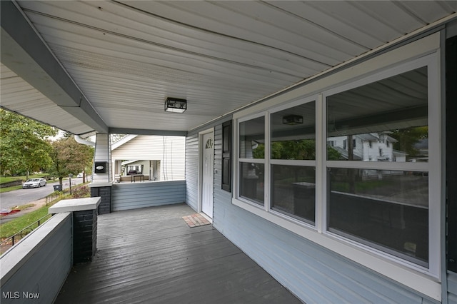 wooden deck featuring covered porch