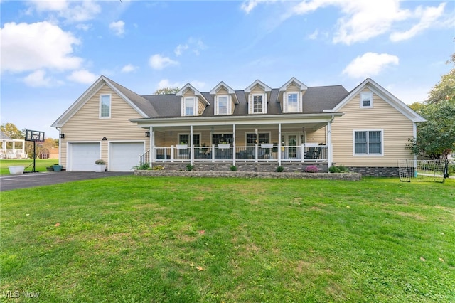 cape cod home with a garage, a front lawn, and covered porch