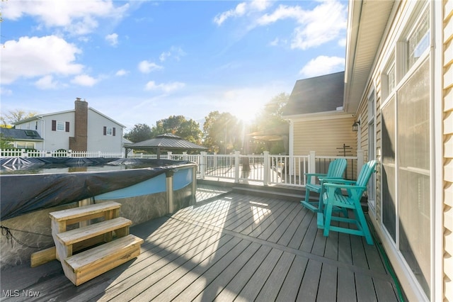 deck with a covered pool