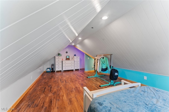 bedroom featuring vaulted ceiling and hardwood / wood-style flooring