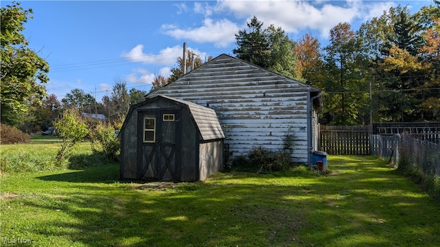 view of outbuilding featuring a yard