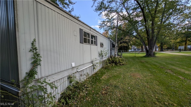 view of home's exterior featuring a yard