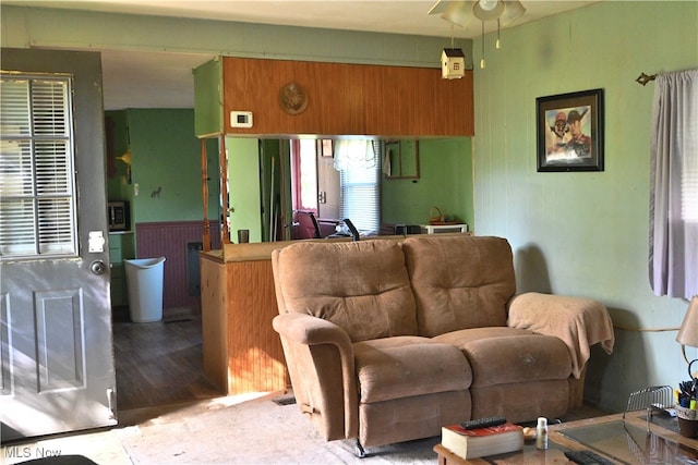 living room featuring hardwood / wood-style flooring and ceiling fan