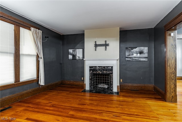 unfurnished living room with wood-type flooring